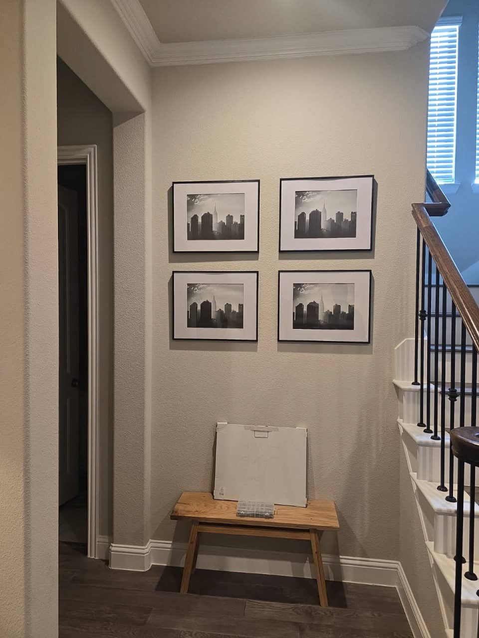 Framed artwork professionally mounted and hung on a living room wall