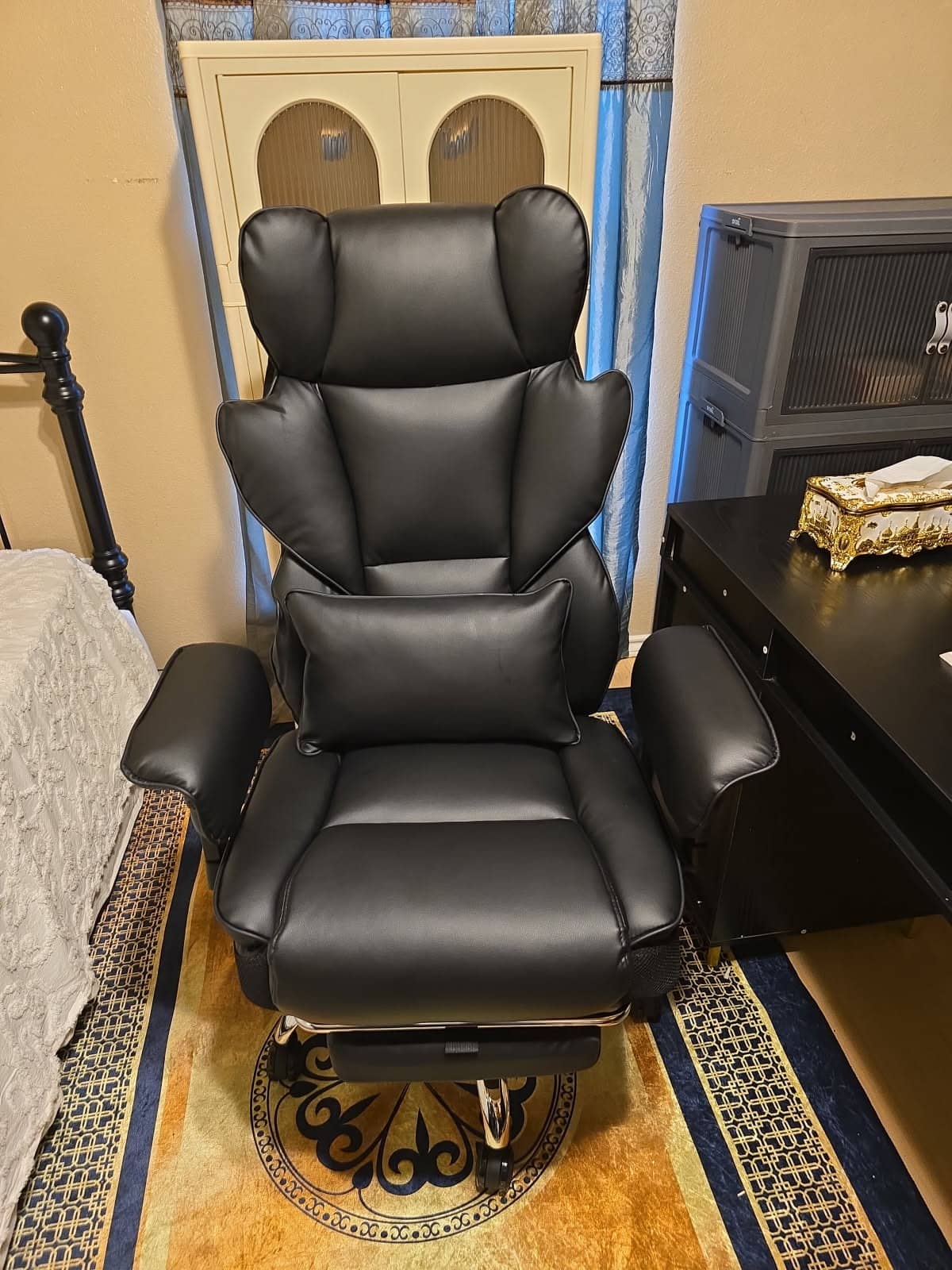 Executive leather office chair with lumbar support assembled in a bedroom office